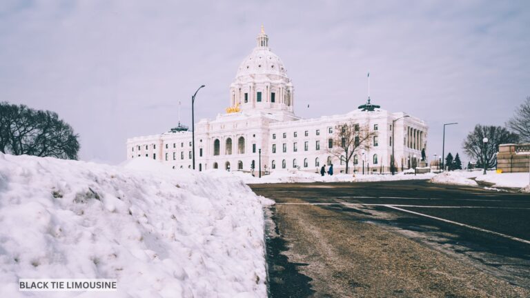 Snow-lined road leading to the Minnesota State Capitol in Saint Paul, showcasing the frigdet beauty of a Twin Cities winter evening.
